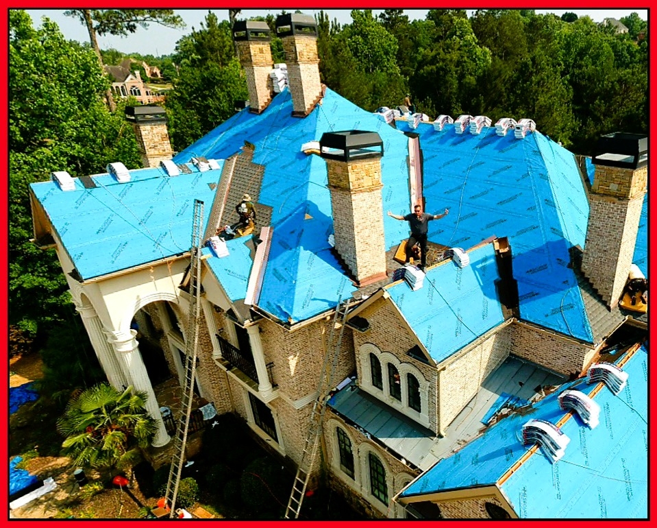 Step flashing and drip edge detail on a residential roof installation in metro Atlanta